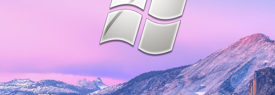 Un logo a quattro vetri argentati è esposto contro un cielo rosa e viola sopra una catena montuosa. Sotto il logo, il testo recita: The way texts should be.