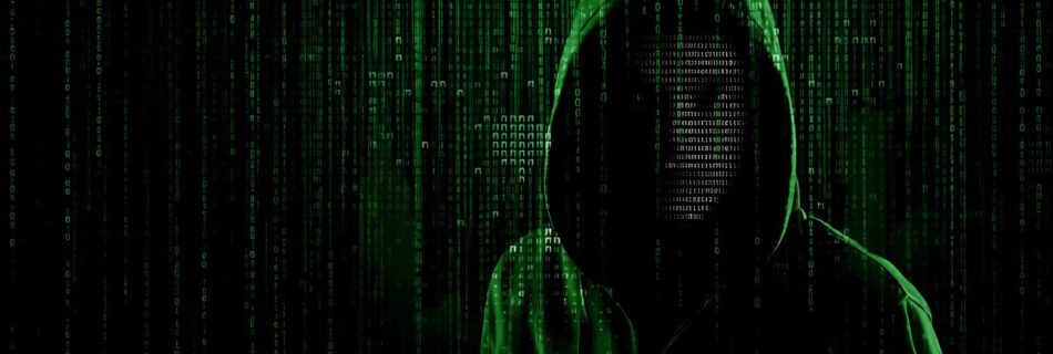 L'immaigne mostra in penombra un hacker nel lato oscuro della rete internet.